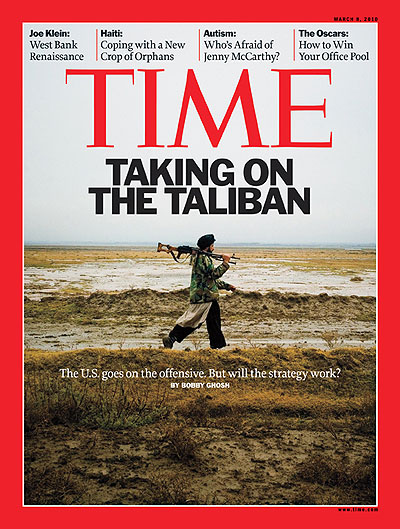 A member of the Taliban walks through the desert
