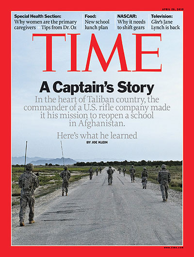 U.S. soldiers walk along a road in Afghanistan