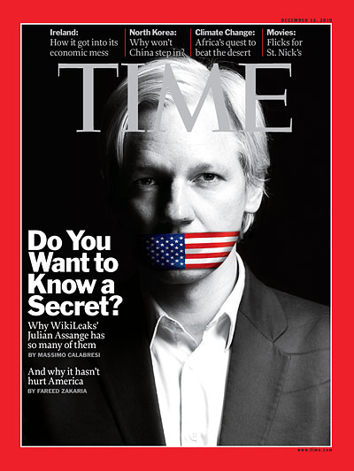 A black and white photo of Julian Assange with his mouth covered by the American flag