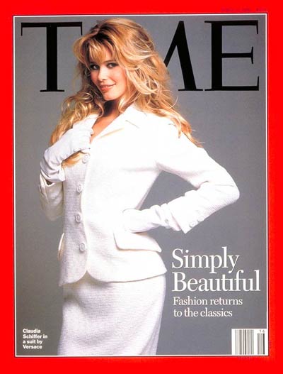 Supermodel Claudia Schiffer wearing a white Gianni Versace suit