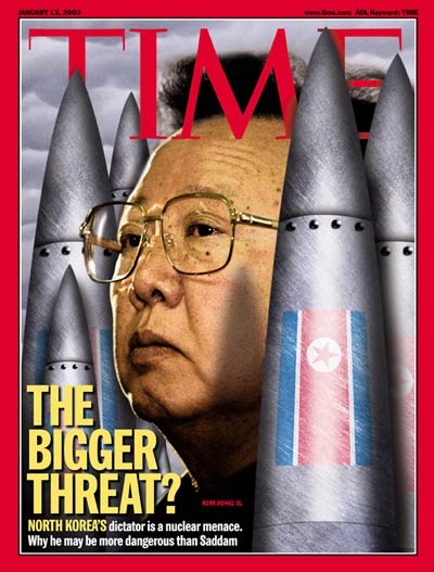 North Korean leader Kim Jong Il framed by nuclear missiles, from Itar/Tass.