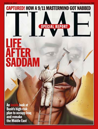 Man whitewashing picture of Iraq leader Saddam Hussein.