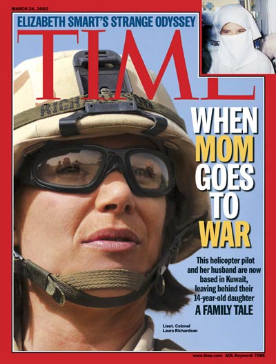 U.S. Army helicopter pilot Laura Richardson. Women serving in combat. U.S. Army helicopter pilot Laura Richardson on duty in Kuwait. Mothers going to war. From Corbis.