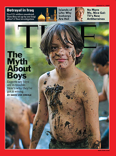 A young shirtless boy with mud all over him. David Burnett/Contact