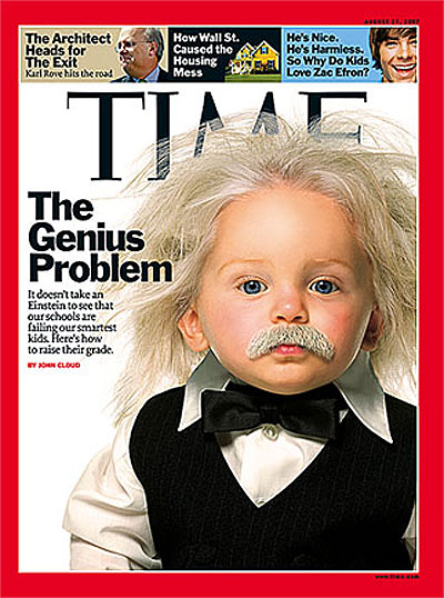 Photo of baby Einstein with little fake mustache in a little tux