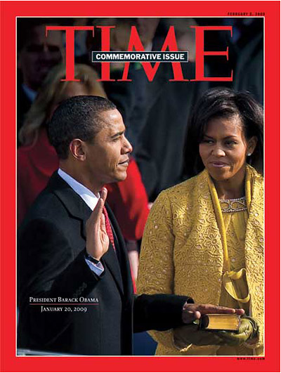 President Barack Obama swearing in on the Bible Michelle Obama holds