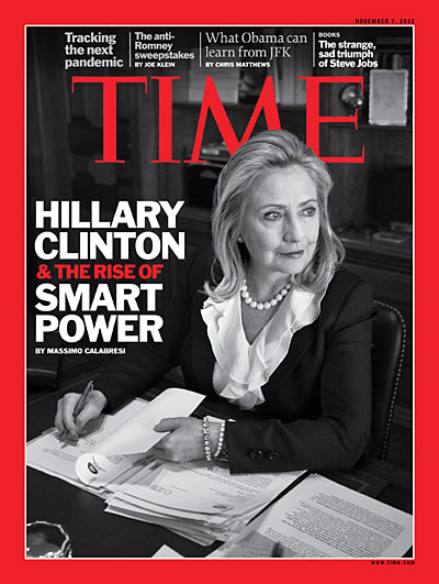 A portrait of Hillary Clinton at her desk