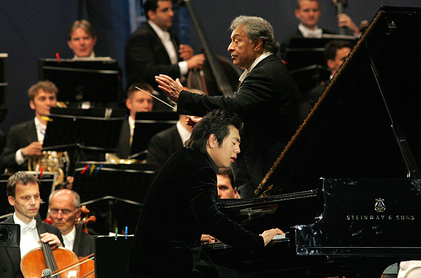 Conductor Zubin Mehta and Lang Lang play with the Vienna Philharmonic Orchestra in front of Schoenbrunn castle in Vienna, Austria