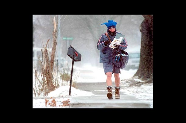 Russ Hruby, a postal carrier in Missoula, Mont., walks his route in a pair of shorts Russ Hruby, a postal carrier in Missoula, Mont., walks his route in a pair of shorts