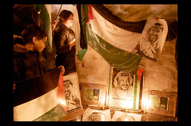 Supporters hold candles and portraits outside Percy Military Hospital in Clamart, France, where Palestinian President Yasser Arafat is being treated in the intensive care unit Supporters hold candles and portraits outside Percy Military Hospital in Clamart, France, where Palestinian President Yasser Arafat is being treated in the intensive care unit