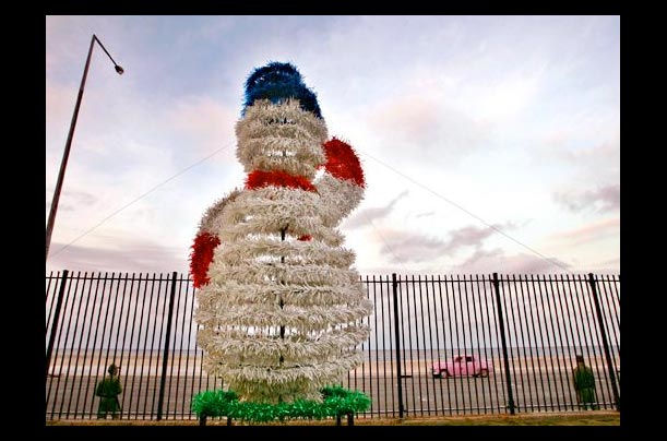Cuban soldiers stand guard outside the U.S. diplomatic mission in Havana, where a Christmas display can be found following the legalization of Christmas festivities by the Castro administration following Pope John Paul II's visit in 1997