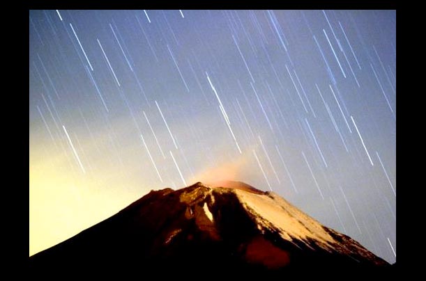 The meteor shower, Geminid, occurred over the Mexican volcano Popocatepeti near the village San Nicolas de los Ranchos