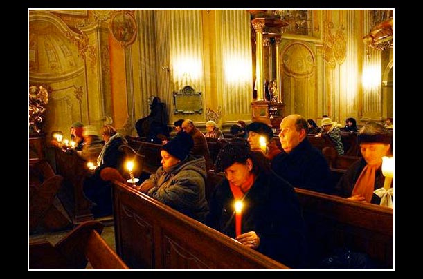 poles pray wednesday inside warsaw's st. anna church for pope john paul II