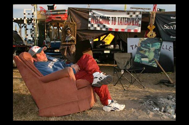 A fan relaxes at Daytona International Speedway before the start of the Daytona 500 in Daytona Beach, Fl.