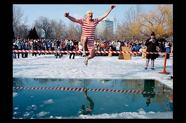 A hungarian jumps into Lake Balaton during a winter farewell festival in Balatonalmadi, Hungary