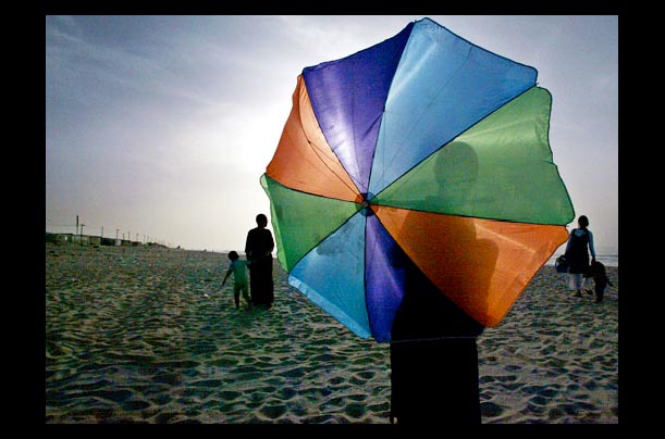 Jewish settlers enjoy the beach near the Jewish settlement of Neve Dekalim in the Gush Katif block of the Gaza Strip