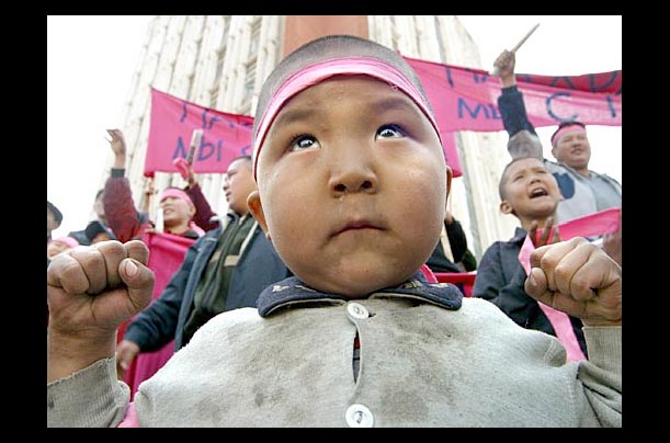 A Kyrgyz boy attends an opposition rally in Bishkek, Kyrgyzstan, as demonstrators seized power A Kyrgyz boy attends an opposition rally in Bishkek, Kyrgyzstan, as demonstrators seized power