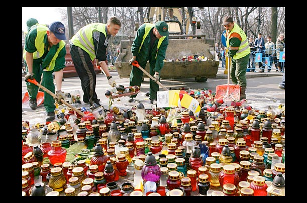 Municipal workers clean the area in front of Archbishop of Cracow's place in Poland the day before Pope John Paul II's funeral.