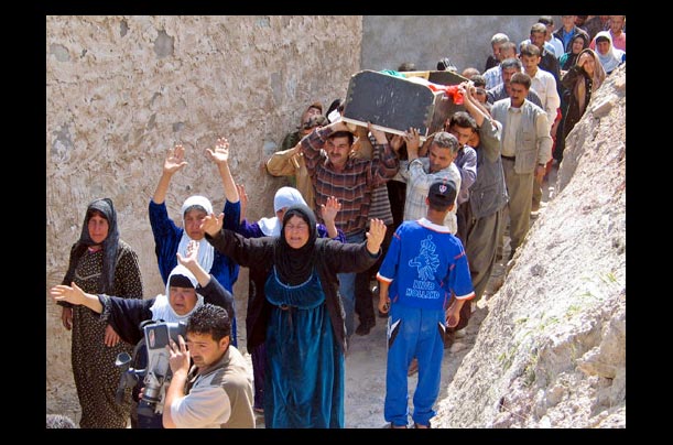 Mourners carry the coffin of 23-year-old Iraqi soldier Muhammed Saeid
