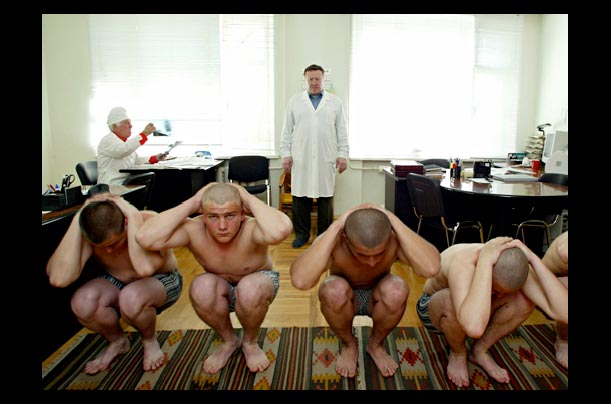 A doctor examines a group of conscripts for the Russian army at a recruiting station in Stavropol, Russia