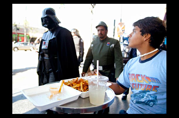 A person dressed as Darth Vader walks on Hollywood Boulevard to celebrate the release of Star Wars: Episode III -- Revenge of the Sith