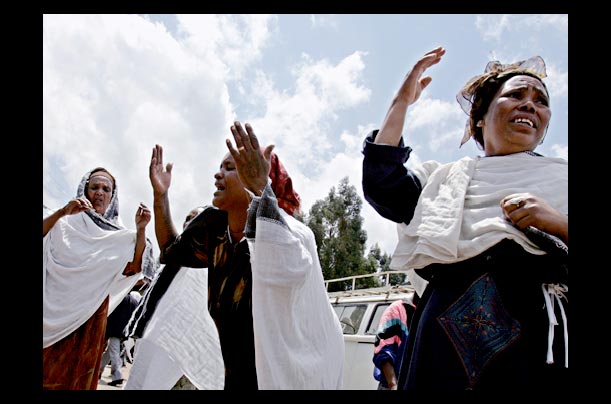 Ethiopian women cry after viewing the bodies of their loved ones at the Menelik II funeral morgue in Addis Ababa