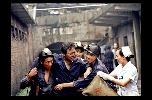 A Chinese miner is evacuated from a coal mine pit after as gas leak in Loudi in China's Hunan province A Chinese miner is evacuated from a coal mine pit after as gas leak in Loudi in China's Hunan province
