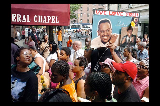 Fans of singer Luther Vandross wait at his wake in New York after he died on July 1