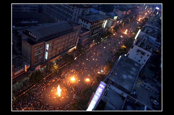 People celebrate at the Liangshan Yi Ethnic Minority Torch Festival in Xichang of Liangshan Yi Autonomous Prefecture, Sichuan Province, southwest China