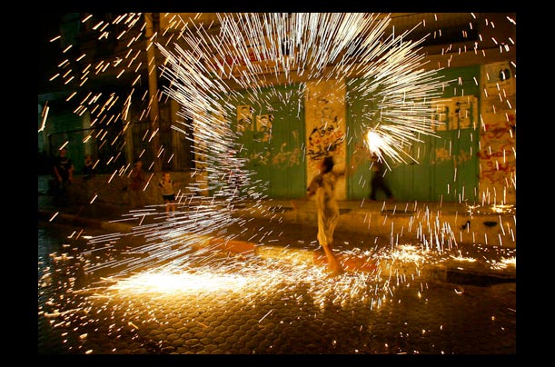 A Palestinian boy celebrates the beginning of the Muslim holy month of Ramadan at the Shati refugee camp in Gaza City