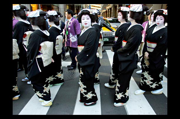 Geishas dressed in kimonos join a parade in downtown Tokyo marking Kabuki actor Ganjiro Nakamura's succession to Tajuro Sakata