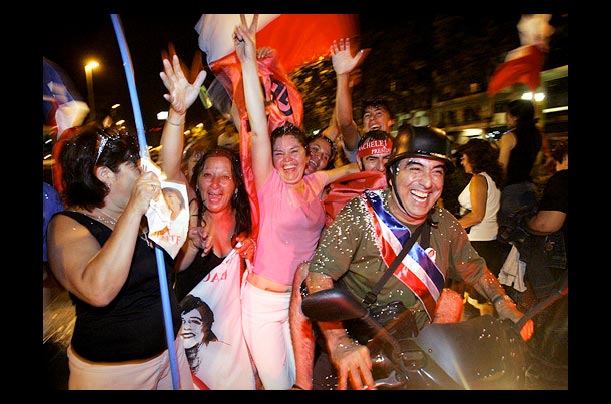 Supporters of Socialist candidate Michelle Bachelet celebrate her victory in the run-off presidential elections in Santiago, Chile