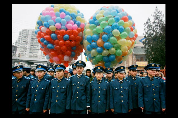 Chinese police stand guard during the opening of the Temple of the Earth Park fair in Beijing, as China celebrates the Lunar New Year of the Year of the Dog