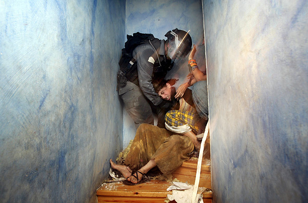 Israeli police officers remove a Jewish settler from a house in the West Bank town of Hebron.