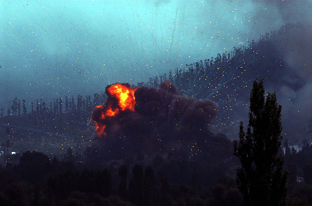 An Indian Army weapons cache caught fire and set off numerous explosions in Srinagar, Kashmir. At least two soldiers were killed and 35 people were injured.
