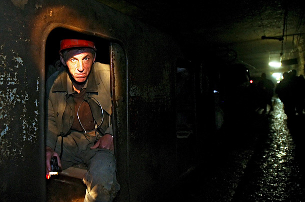 A miner looks out of a carriage in Leningradskaya slate mine in the town of Slantsy, Russia. The Leningradskaya mine has a store of 2.5 million tons of shale oil. 



