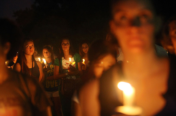 Mourners gather during a candlelight vigil for victims of Hurricane Katrina in Jackson Square in New Orleans, Louisiana.