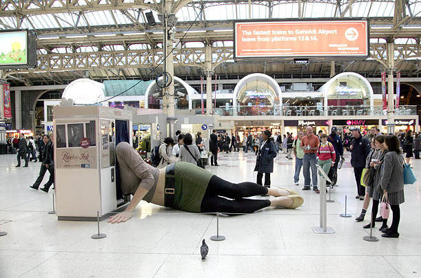 A giant female figure is sprawls across the concourse at Victoria Station in central London to mark the launch of a new television show called 'London Ink.'