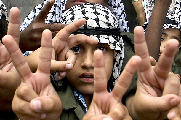 Young Palestinians march at a rally in honor of the third anniversary of the death of Yasser Arafat in Rafah, in the Gaza Strip.