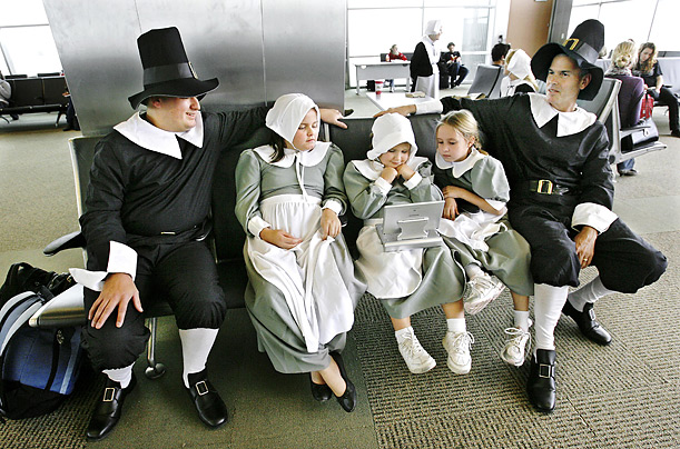 The Pace and Pena families dawned Pilgrim costumes for their flight from Okalahoma City to Denver. 

