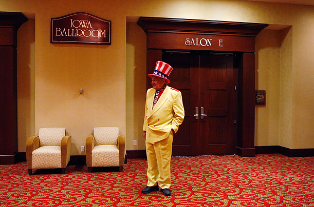 Oscar Poole waits outside a New Year's Eve press conference by Republican presidential hopeful Mike Huckabee at the Marriott Hotel in Des Moines, Iowa.
