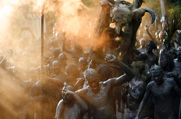 The Bloco de Lama samba group gathers on Jabaquara beach in Parati, Brazil, as part of the Carnival celebrations.