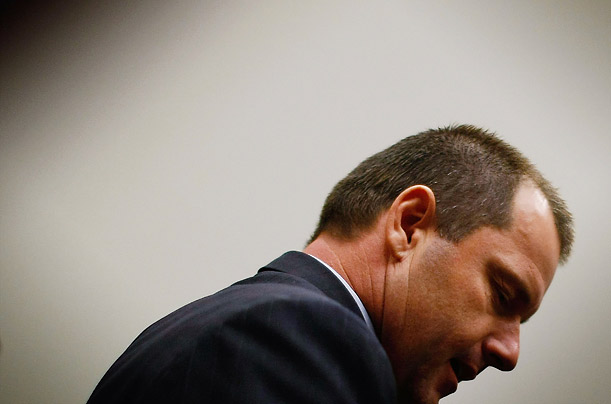 Major League Baseball player Roger Clemens rises for a break during the House Oversight and Government Reform Committee hearing on the use of steroids and