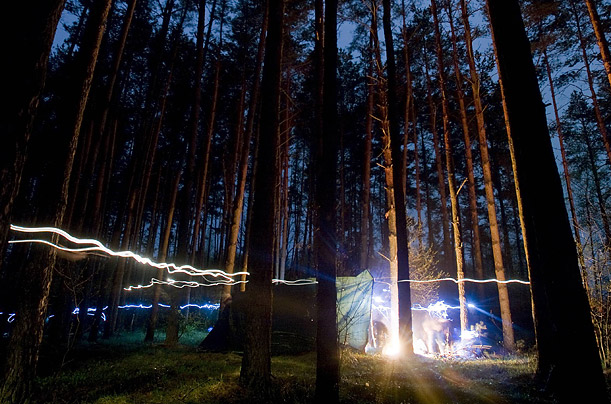 A time exposure photo captures the action at a camp of Belarussian rescuers near the village of Borkhov, southeast of Minsk. About 110 professional and amateur rescuers take part in the annual competition.