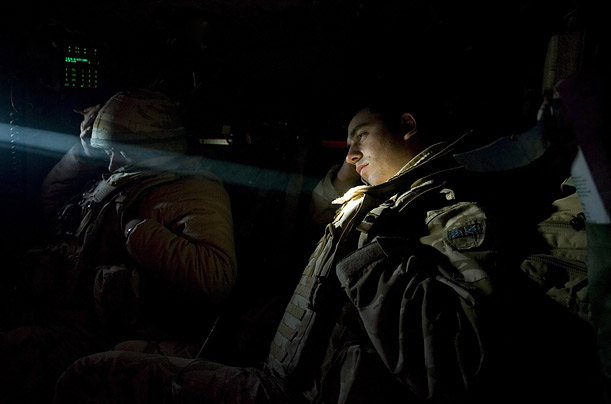 Two British soldiers rest after a day of patrols in the area around Basra, Iraq.