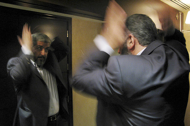 Hamas leader Khaled Meshaal combs his hair in his hotel room in Abu Dhabi, United Arab Emirates. An Egyptian-brokered truce between Israel and Hamas went into effect Thursday. Hamas leader Khaled Meshaal combs his hair in his hotel room in Abu Dhabi, United Arab Emirates. An Egyptian-brokered truce between Israel and Hamas went into effect Thursday.