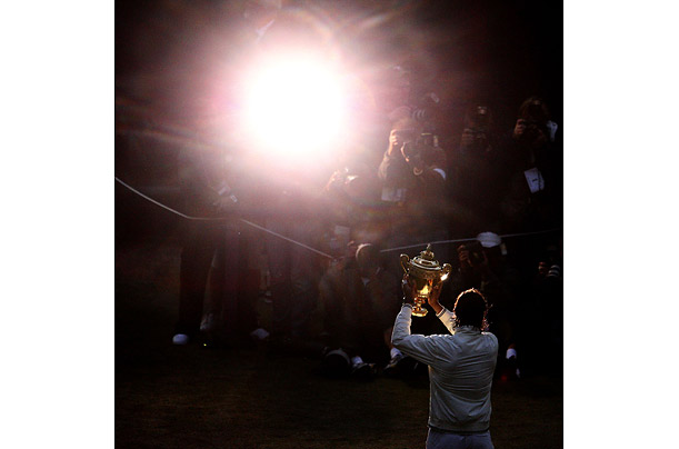 Spain's Rafael Nadal celebrates with the trophy after winning the Men's Singles Final at the 2008 Wimbledon Championships in London.
