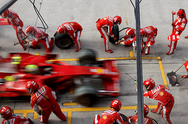 Formula One driver Felipe Massa makes a pit stop during qualifying rounds at the Fuji Speedway racing circuit in Japan.

