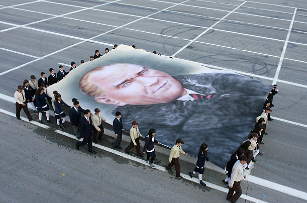 Students carry a picture of Mustafa Kemal Ataturk, founder of modern Turkey, during a parade marking the 85th anniversary of the country's Republic Day. 

