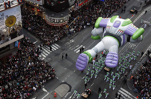 The Buzz Lightyear balloon makes its way through Times Square during the Macy's Thanksgiving Day Parade in New York.

